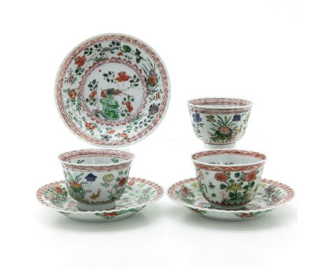 Depicting scene in garden with floral and bird, marked with double ring and conch shell, saucers are 13 cm. in diameter, hair