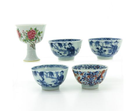 Famille Rose enamel stem cup with three blue and white and one Imari decor cup, stem cup is 8 cm. tall, in diverse conditions