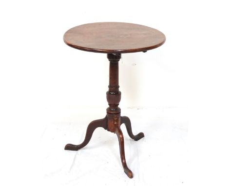 19th CENTURY AND LATER WALNUT WINE TABLEthe circular tilt top above a turned column with a tripod base, 51.5cm wide