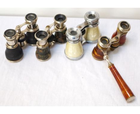 CASED PAIR OF CONTINENTAL OPERA GLASSESwith faux mother of pearl, a pair with a swing handle and faux tortoise shell and two 