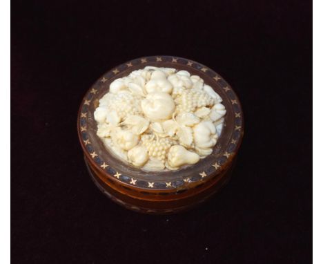 LATE 18th/EARLY 19th CENTURY IVORY MOUNTED BLONDE TORTOISESHELL PATCH BOXthe cover with carved ivory panel depicting fruit an