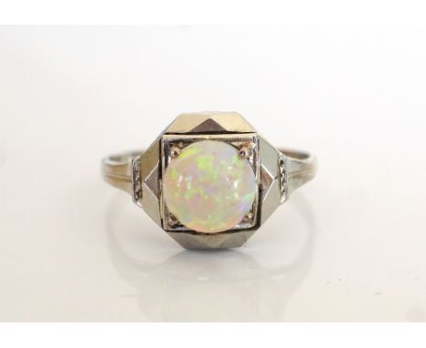 FRENCH ART DECO OPAL SET RINGthe eighteen carat white gold shank with angular setting and circular cabochon opal, ring size K