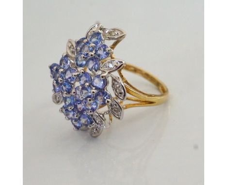 TANZANITE AND DIAMOND CLUSTER DRESS RINGthe multi gemstones in floral design setting, on nine carat gold shank, ring size K-L