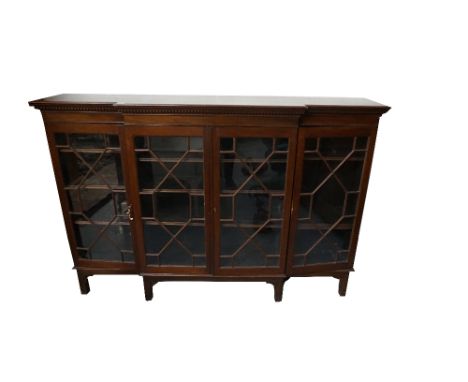 LARGE EDWARDIAN MAHOGANY BREAKFRONT BOOKCASEthe double central glazed astragal doors flanked by similar single doors, all wit