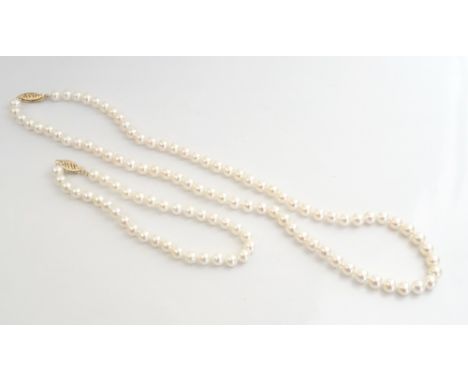 PEARL NECKLACE AND MATCHING BRACELETboth with nine carat gold clasps, 44cm and 20.5cm long respectively (2)