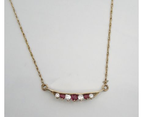RUBY AND CZ PENDANTin nine carat gold and on attached nine carat gold chain