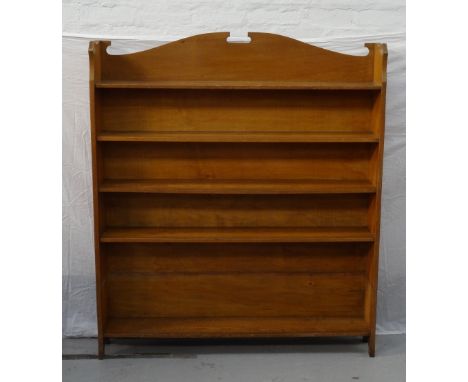OAK OPEN BOOKCASEearly 20th century, with shaped top edge and five shelves (one lower shelf has been removed at some point in