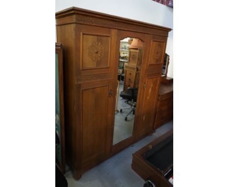 EDWARDIAN OAK BEDROOM SUITEby 'Wylie & Lochhead Ltd., Glasgow', comprising a triple door wardrobe (in two sections), the shap