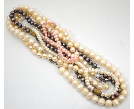 FOUR PEARL NECKLACESincluding one black pearl examples; and a pink pearl bracelet