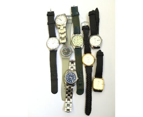 A box containing a selection of various gentleman's wristwatches to include Timex and Lorus.