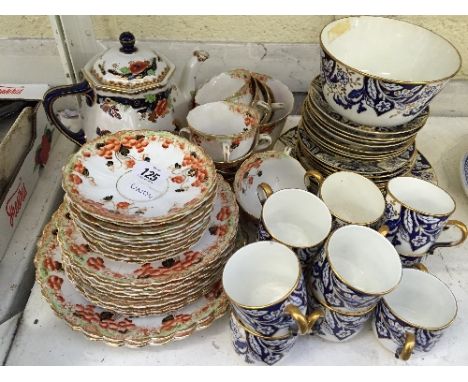 The residue of a late 19th century china tea set together with another.