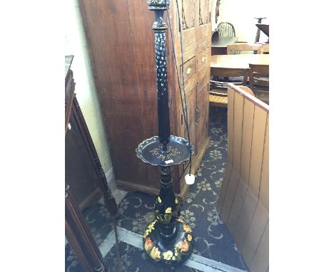 A large Oriental black lacquer standard lamp with mother of pearl inlay to top and flower design to base with centre trinket 