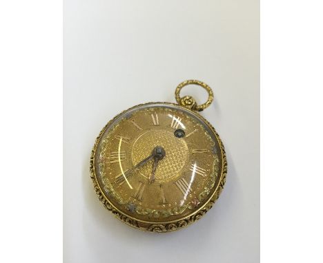 A 19th century ladies' gold open faced pocket watch (possibly 18 carat) with gilt enamel Roman dial face, in floral and engin