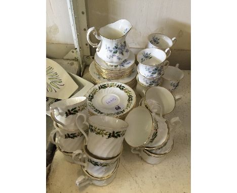 The residue of a Paragon bone china tea service, decorated in the Forget-Me-Not pattern together with the residue of a Delfes
