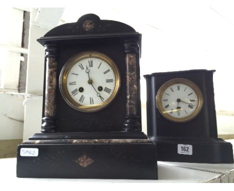A black slate architectural style mantle clock with white enamel Roman circular dial together with a wooden cased black paint