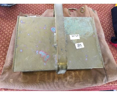 A brass U.S. Lighthouse tool box together with a canvas sack.