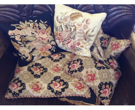 A quantity of tapestry upholstered cushions.