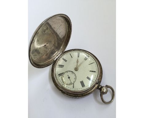 A gentleman's silver full hunter pocket watch with white enamel Roman dial and subsidiary dial (112 grams overall).