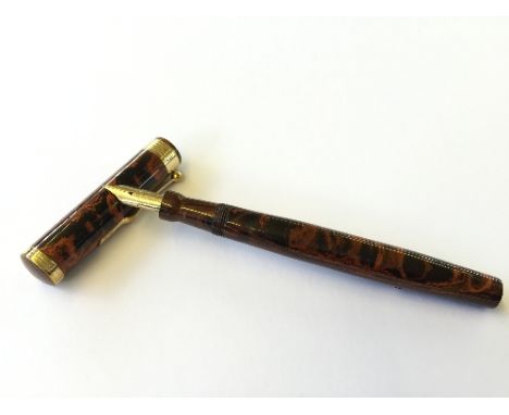 A rare vintage Mabie Todd Swan fountain pen, Model No. E444 with gold coloured bands and a large 14 carat gold nib.