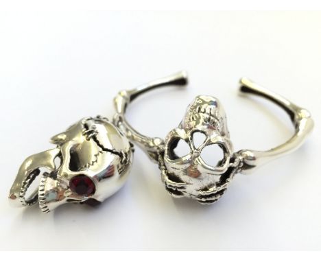 A silver Skull bangle and pendant.