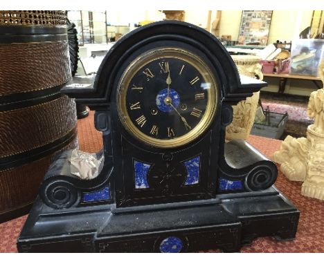 A large slate mantle clock.