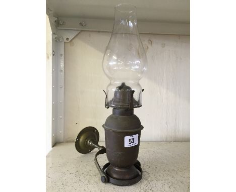 A brass ship's gimbal gas wall light.