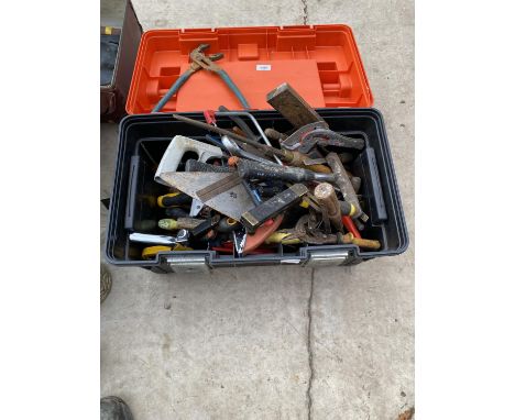 A LARGE PLASTIC TOOL BOX CONTAINING A LARGE ASSORTMENT OF TOOLS TO INCLUDE ADJUSTABLE SPANNERS, TROWELS, SET SQUARES AND FILE