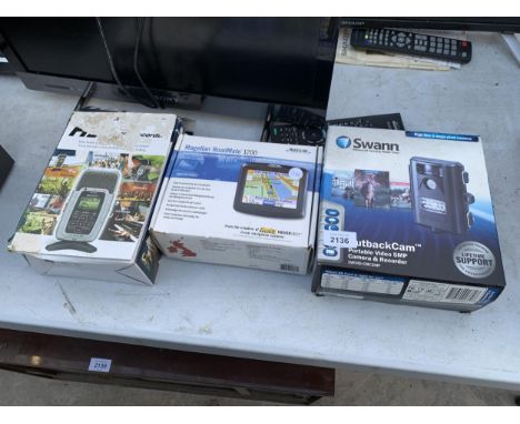 A MAGELLAN SAT NAV, A SWAN SECURITY LIGHT AND A RECORDER 