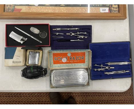 A QUANTITY OF COMPASSES TO INCLUDE BIRK MADE IN GERMANY, RONSON LIGHTER, VINTAGE ROLLS RAZOR, ETC., 