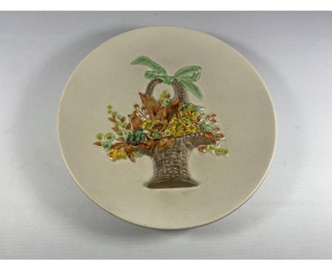 A CLARICE CLIFF POTTERY PLATE WITH BASKET OF FLOWER RELIEF MOULDED DESIGN 