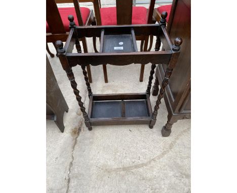 AN EARLY 20TH CENTURY OAK BARLEYTWIST TWO DIVISION STICK STAND 