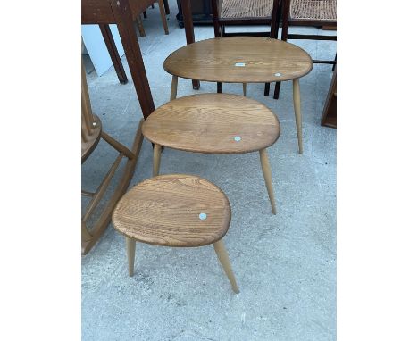 AN ERCOL NEST OF THREE PEBBLE TABLES 