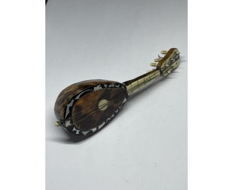 A TORTOISESHELL MINI LUTE 