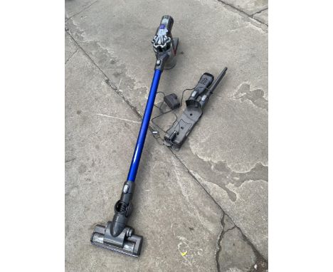 A DYSON DC44 STICK VACUUM WITH CHARGER 