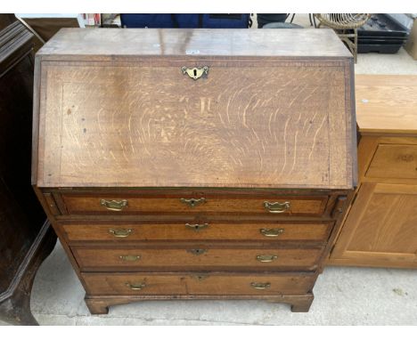 A GEORGE III OAK AND CROSSBANDED BUREAU WITH FITTED INTERIOR, FOUR GRADUATED DRAWERS ON BRACKET FEET, 36" WIDE 