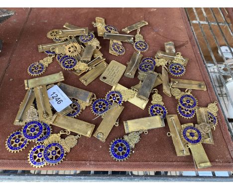A COLLECTION OF BRASS BOLTON ROTARY CLUB BADGES 