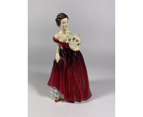 A RADNOR CERAMIC LADY FIGURE IN RED DRESS 