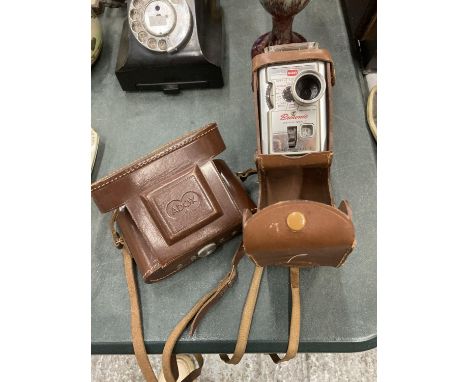 TWOO VINTAGE CAMERAS IN CASES TO INCLUDE A BROWNIE AND AN ADOX 