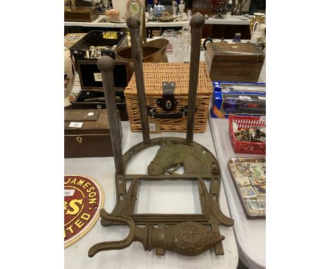 A VINTAGE CAST IRON BOOT SCRAPER AND WELLINGTON HOLDER WITH HORSESHEAD DECORATION 