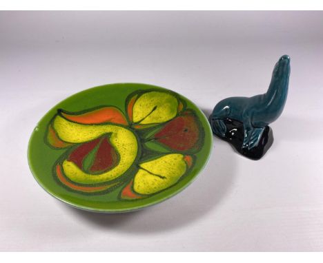 TWO POOLE POTTERY ITEMS - A GREEN DELPHIS PLATE &amp; SEAL FIGURE 