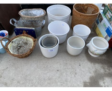 AN ASSORTMENT OF CERAMIC AND WICKER PLANTERS 