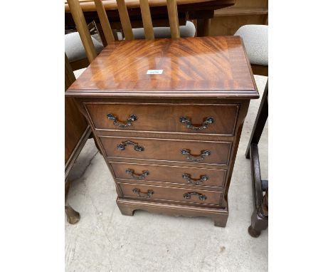 A MINIATURE MAHOGANY AND CROSSBANDED CHEST OF FOUR DRAWERS ON BRACKET FEET, 17.5" WIDE 