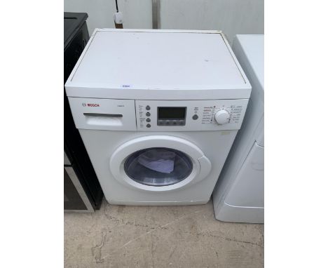 A WHITE BOSCH EXXCEL WASHER DRYER WITH INSTRUCTION MANUAL 