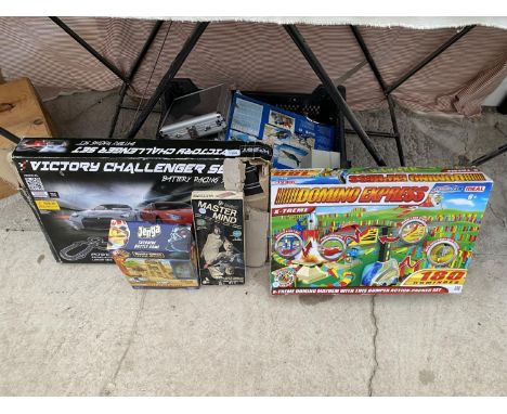 AN ASSORTMENT OF BOARD GAMES TO INCLUDE JENGA, SCRABBLE AND HOBBY ENGINE TRACK ETC 