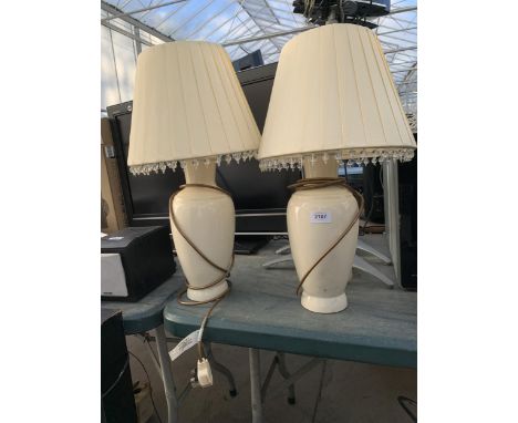 A PAIR OF CREAM CERAMIC TABLE LAMPS 