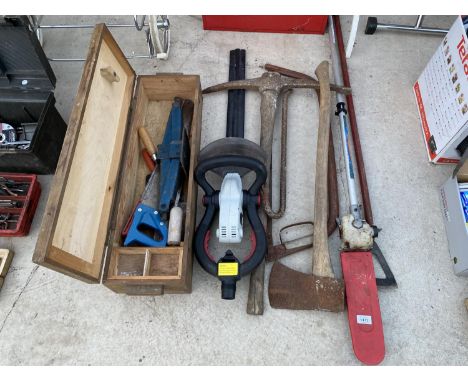AN ASSORTMENT OF TOOLS TO INCLUDE AN AXE, A PICK AXE AND A CHAINSAW POLE ETC 