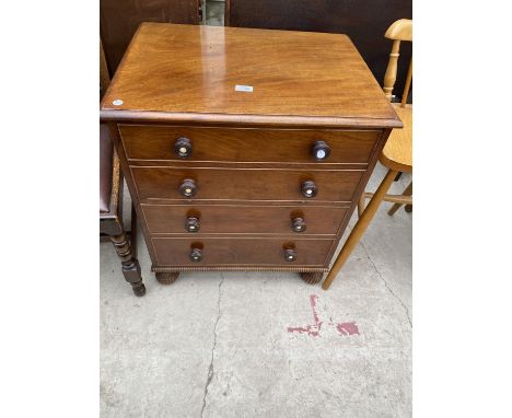 A 19TH CENTURY MAHOGANY CHEST COMMODE WITH TURNED HANDLES AND BALL FLUTED LEGS 