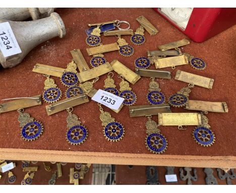 A COLLECTION OF BRASS BOLTON ROTARY CLUB BADGES 