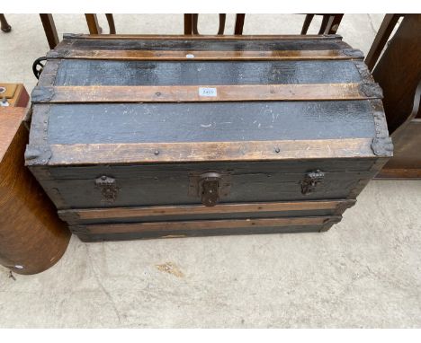 A 19TH CENTRY DOMED TOP BANDED TRAVELLING TRUNK 