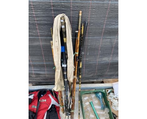 AN ASSORTMENT OF VINTAGE SPLIT CANE FISHING RODS AND MODERN CARBON FIBRE RODS 